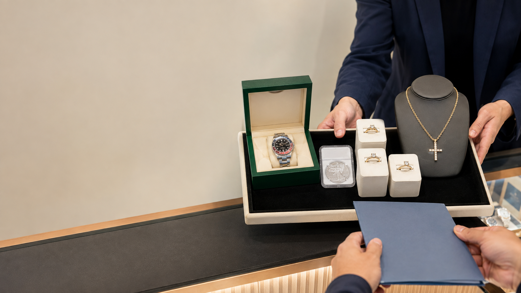 Jewelry, a luxury watch and a graded coin being presented for a private evaluation