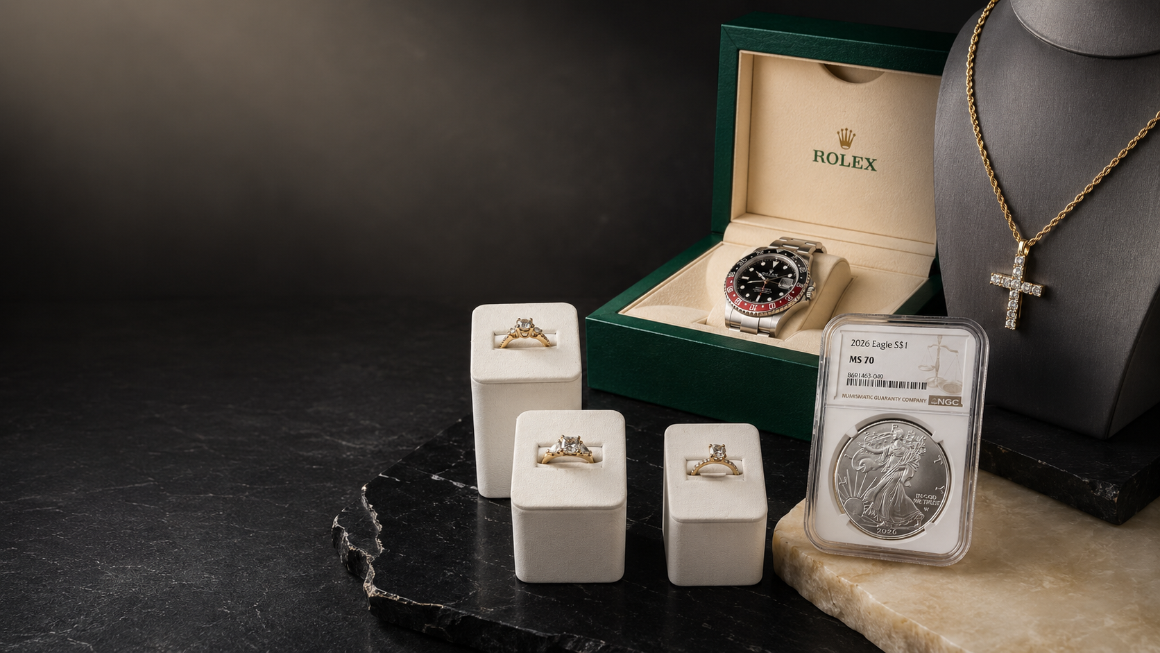 Diamond rings, a luxury watch, gold jewelry and a graded silver coin purchased by Broadway Jewelry and Rare Coins